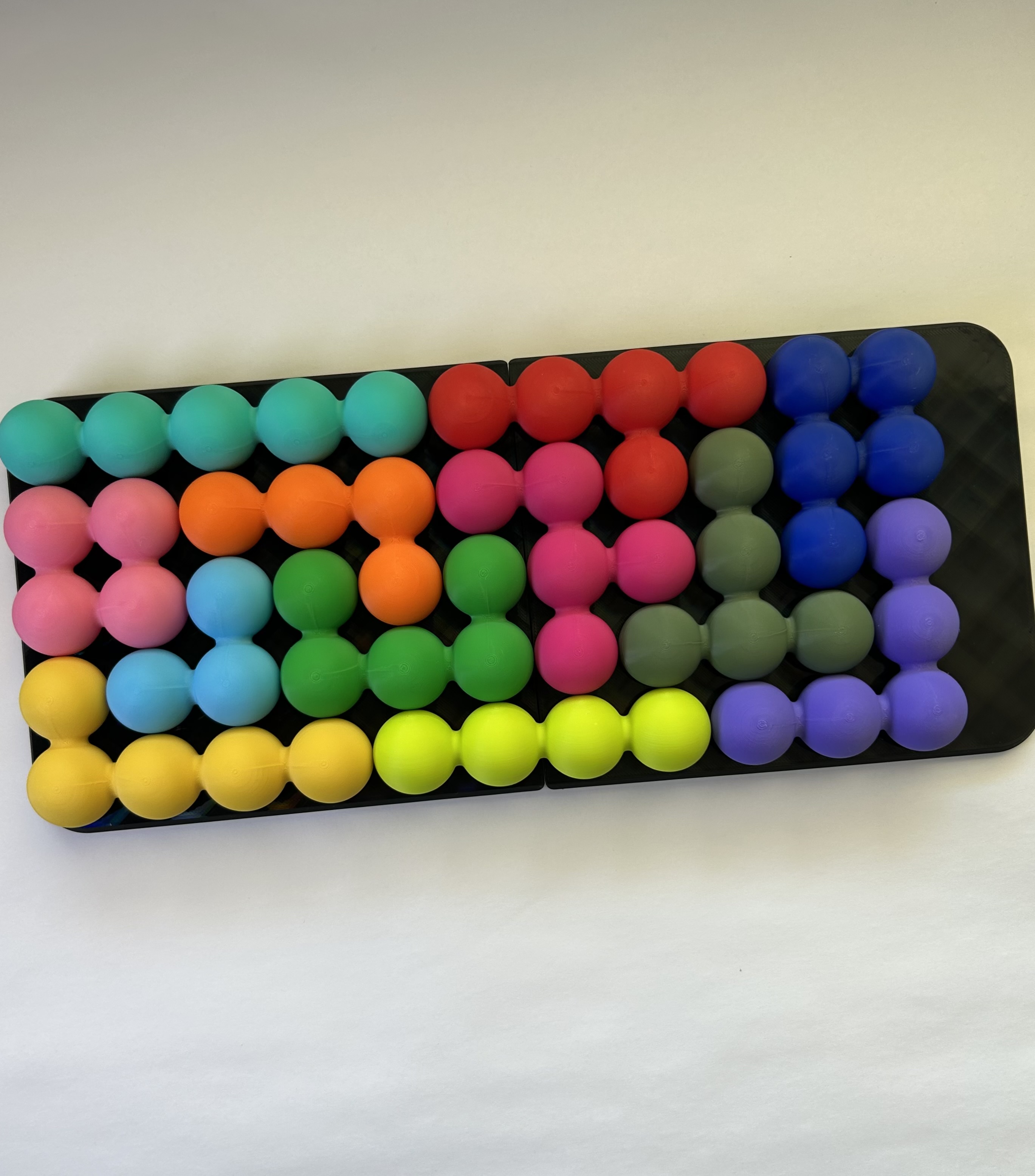 Overhead view of the giant Katachi-Go tray, fully solved