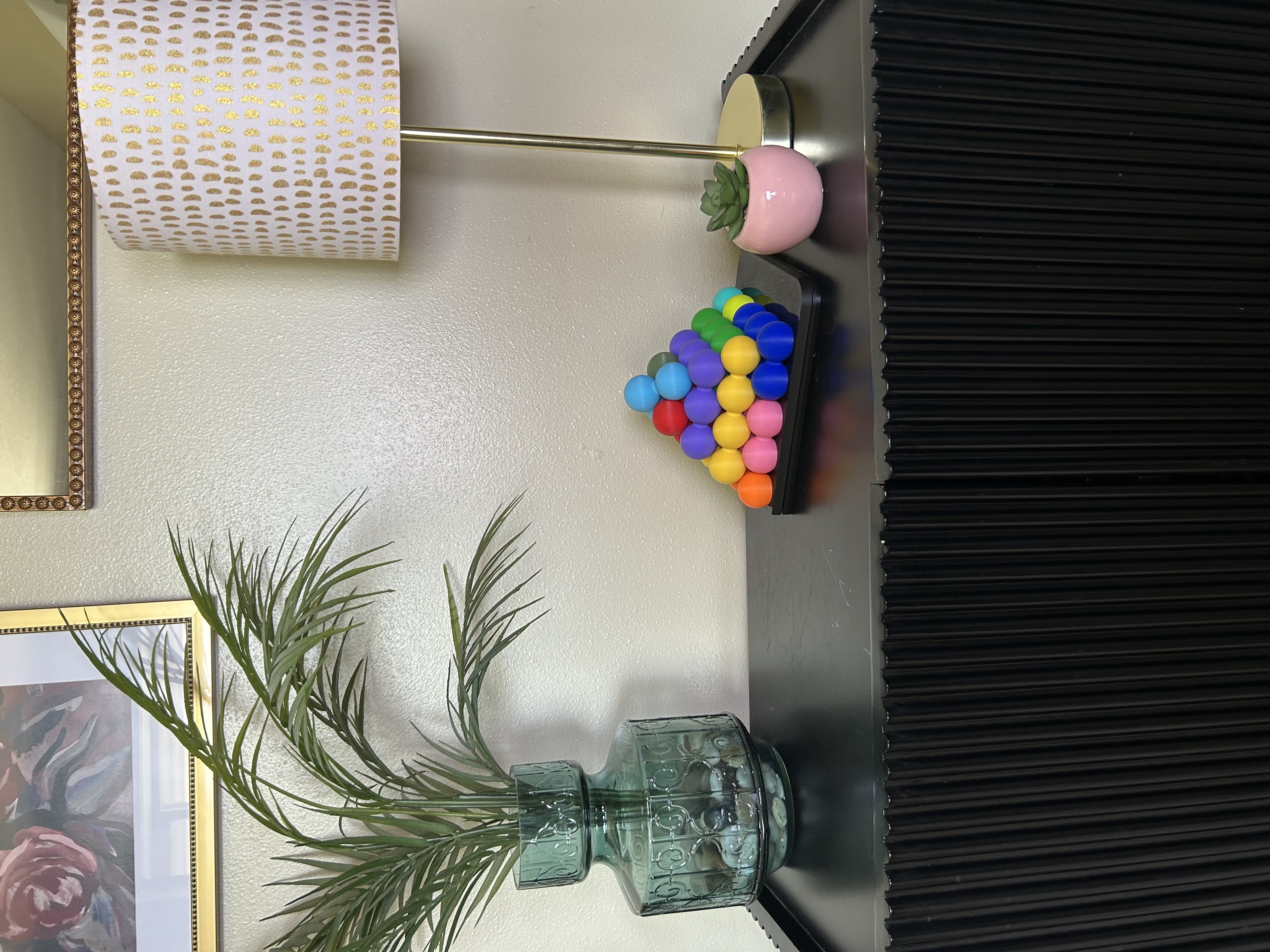 Katachi-Go built into a 3D pyramid, displayed on a shelf next to a lamp and framed art