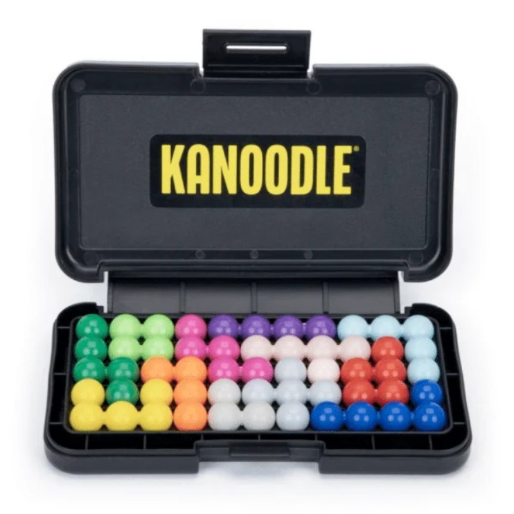 A Kanoodle puzzle set open, showing twelve fused-bead pieces filling its five by eleven tray